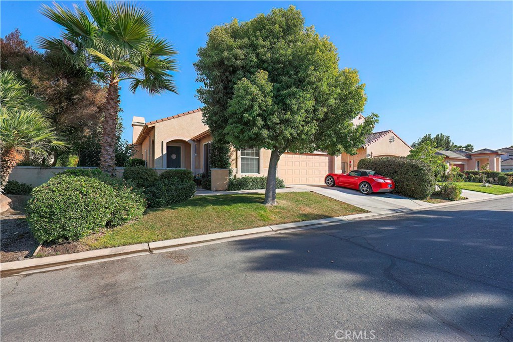 a view of a house with a yard and garage