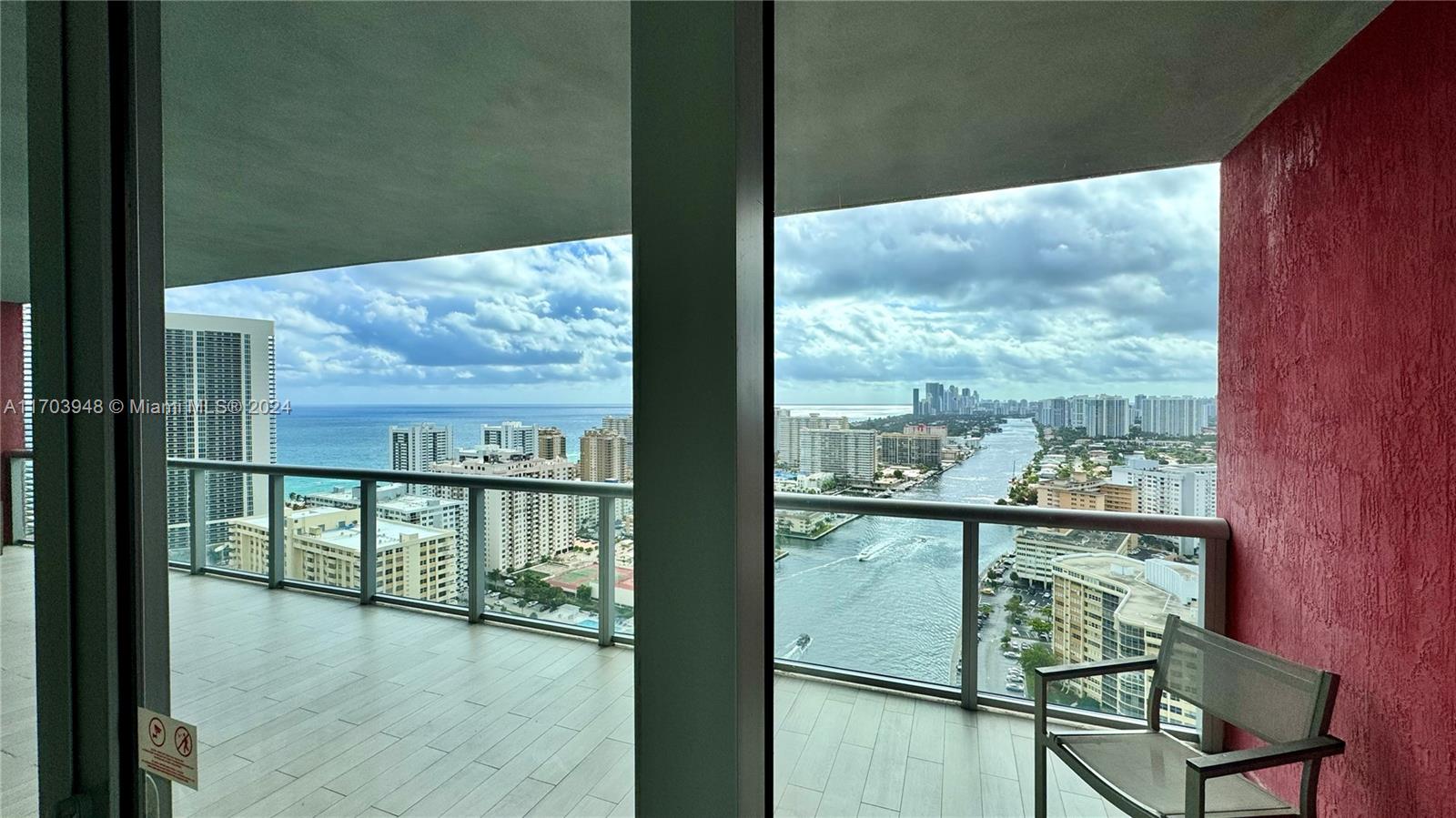 a view of a glass door and a balcony