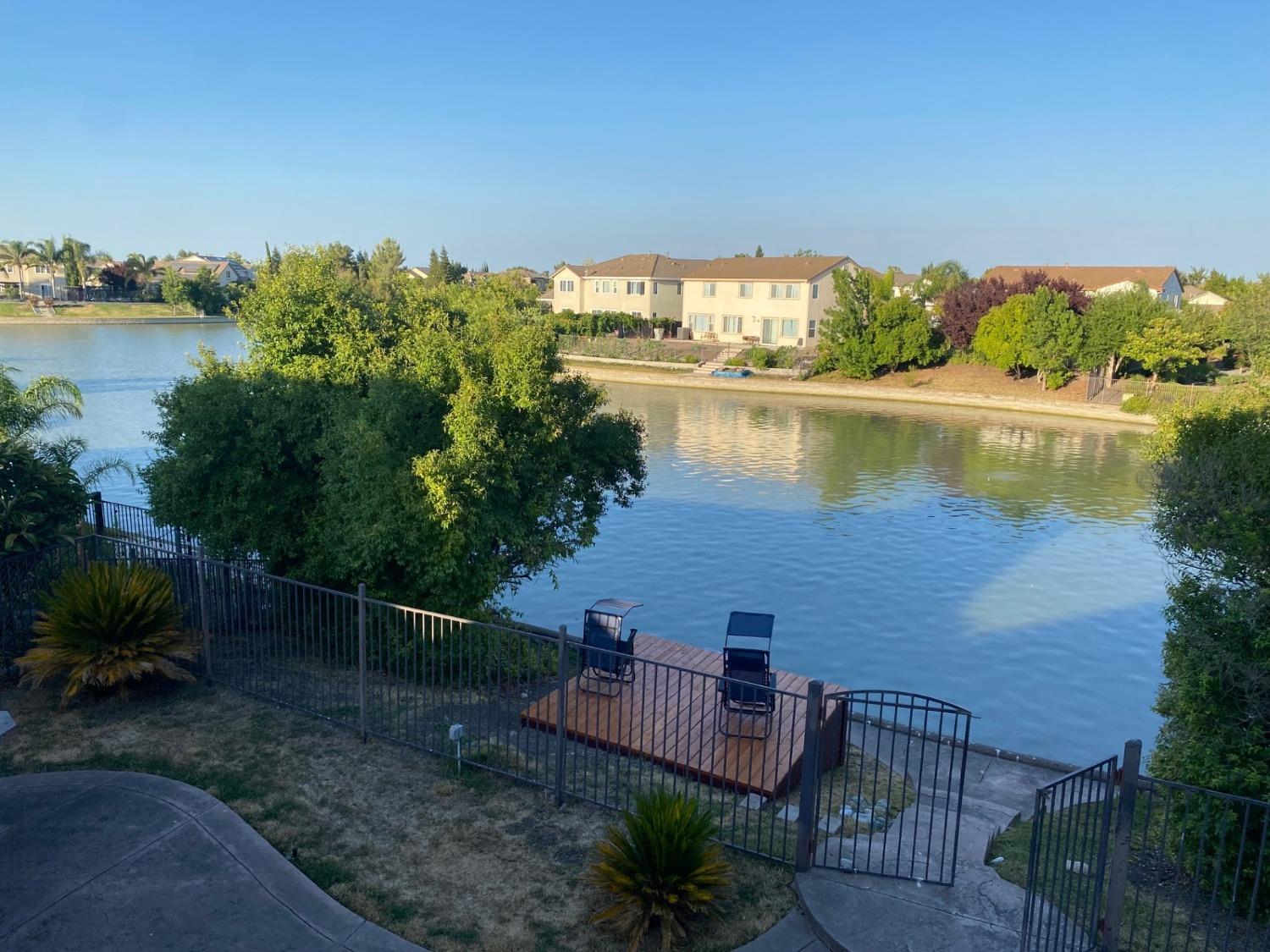 a view of a lake with a outdoor space