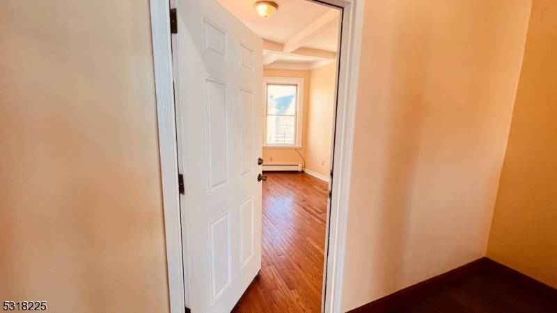 a view of a bathroom from a corridor