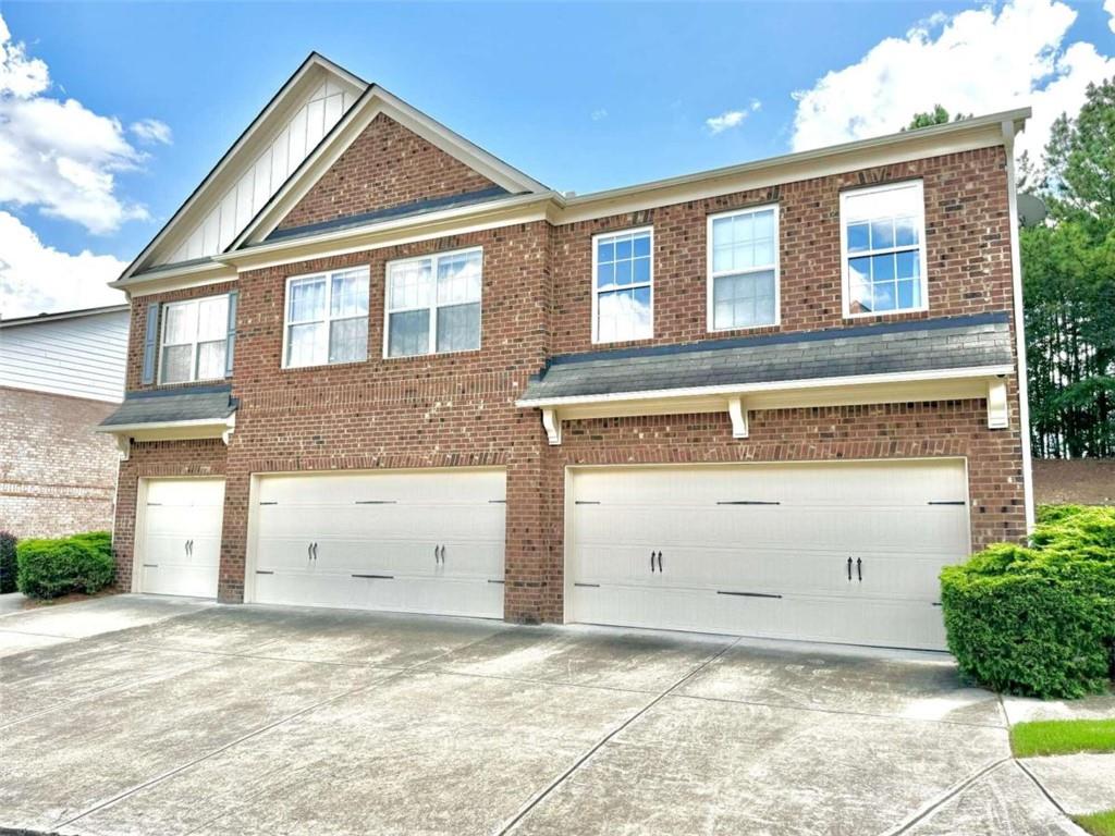 a front view of a house with a garage