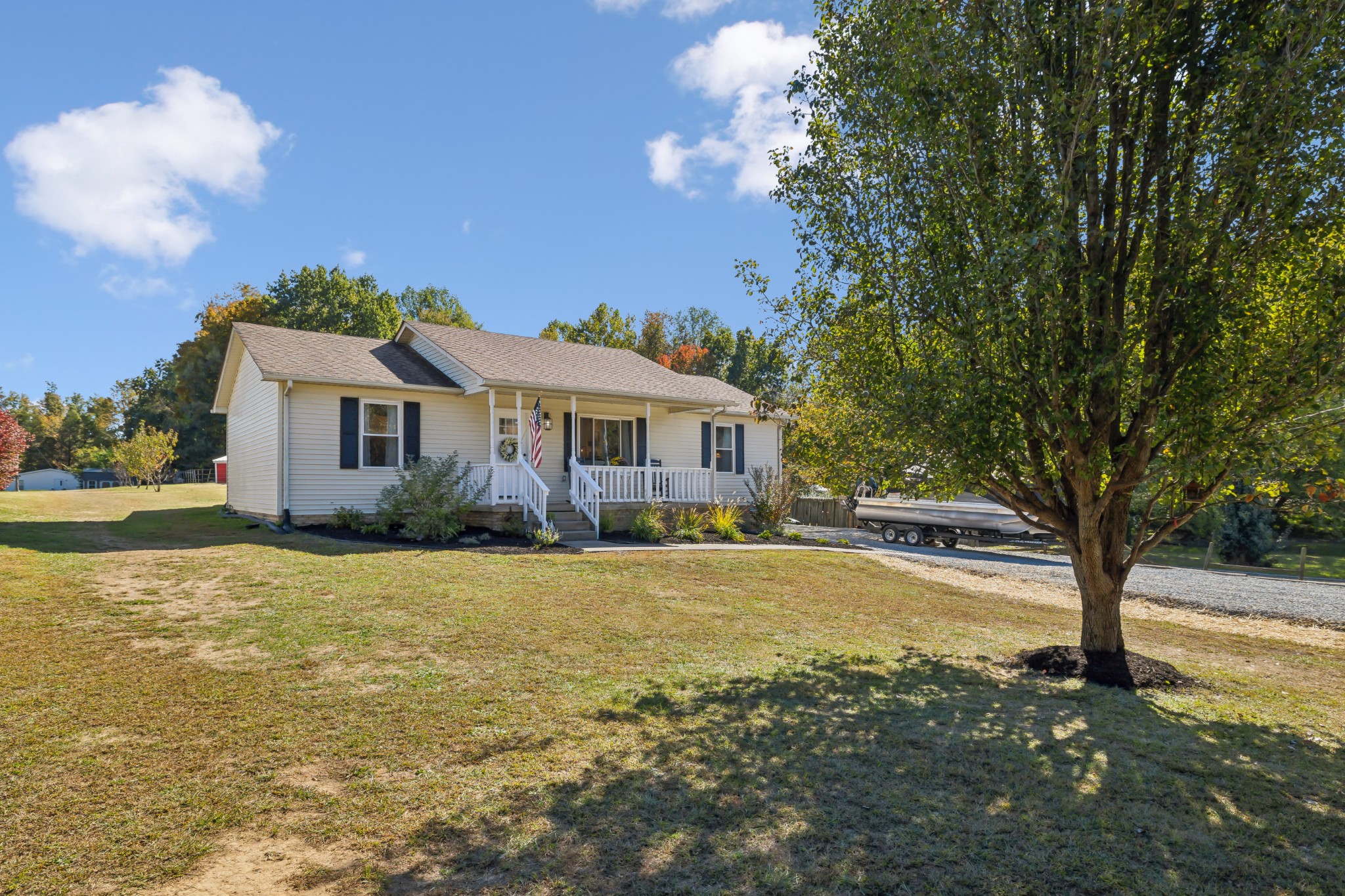 a view of a house with swimming pool and a yard