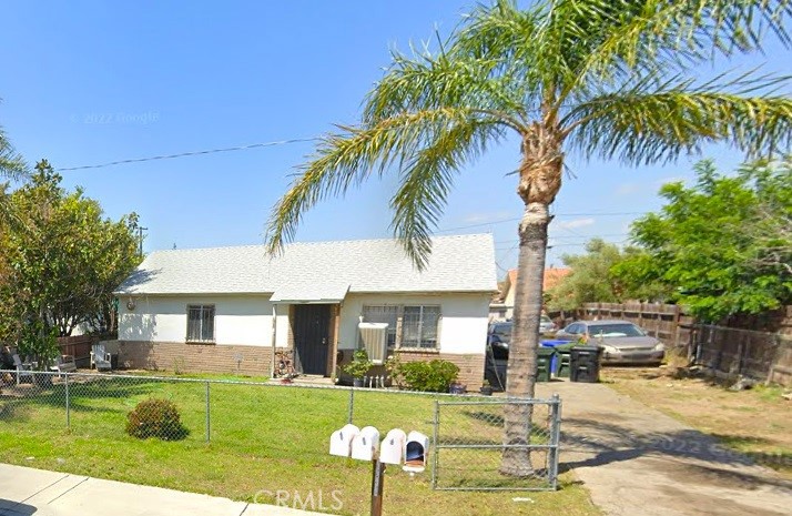 a front view of a house with swimming pool having outdoor seating