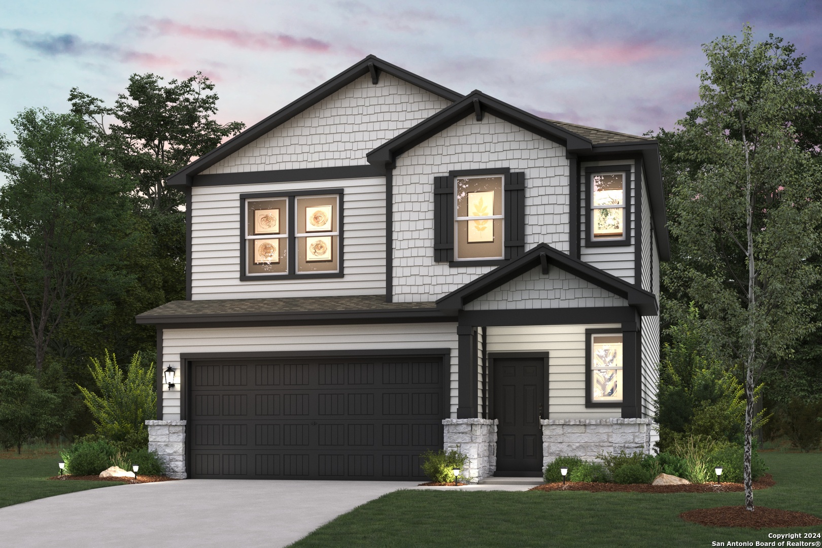 a front view of a house with a yard and garage