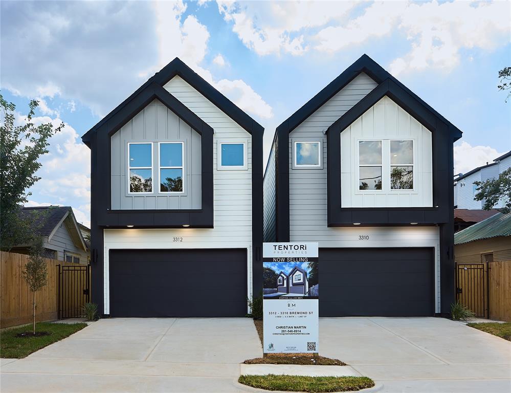 a front view of a house with a garage