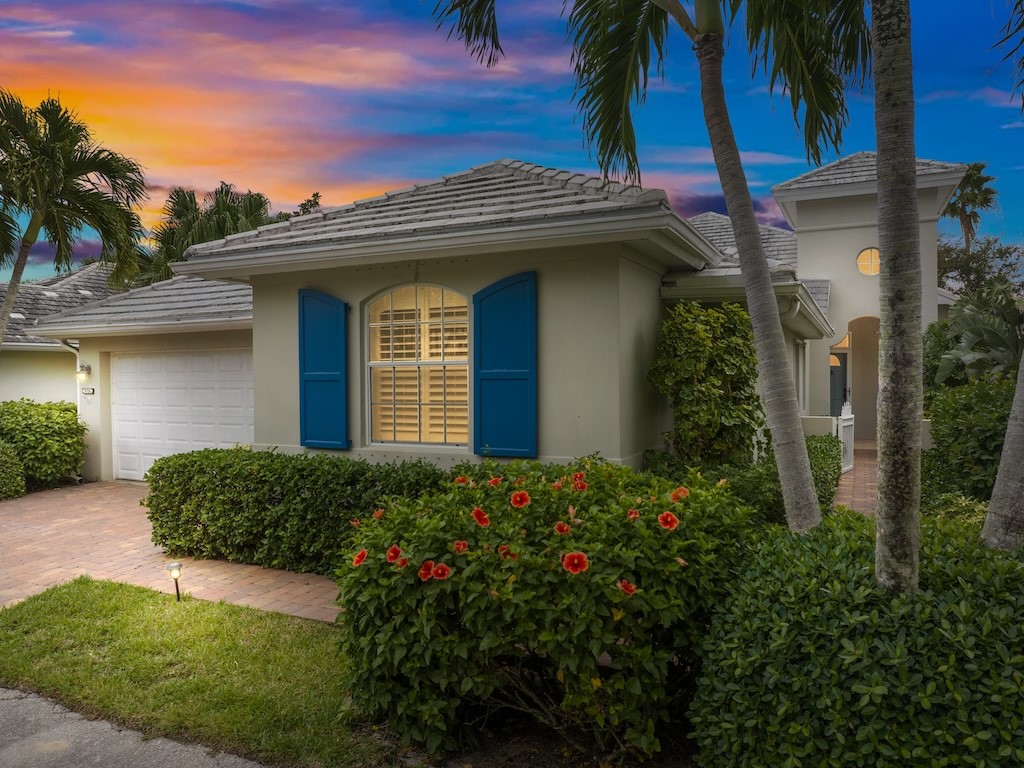 front view of a house with a small yard