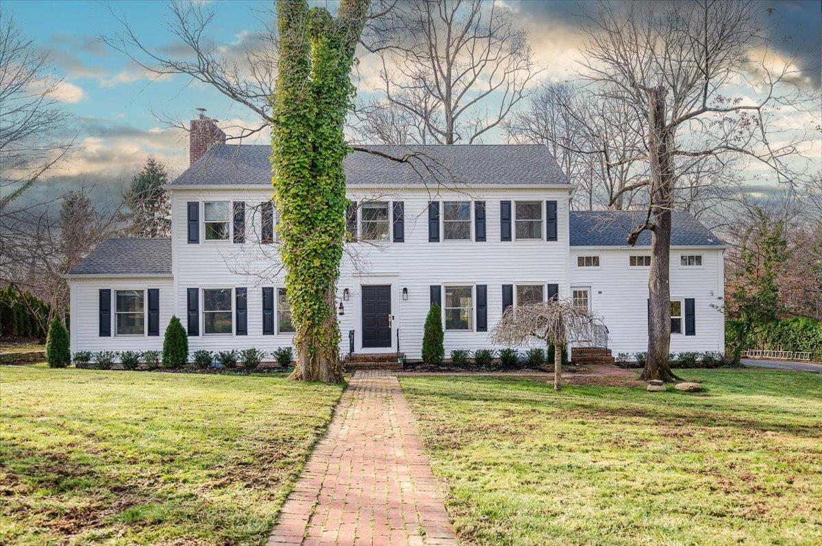 a front view of a house with a yard