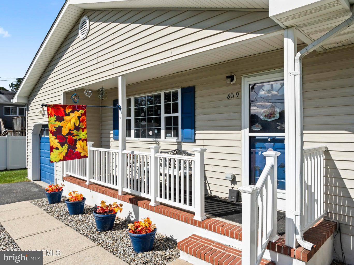 a porch with seating space and stairs