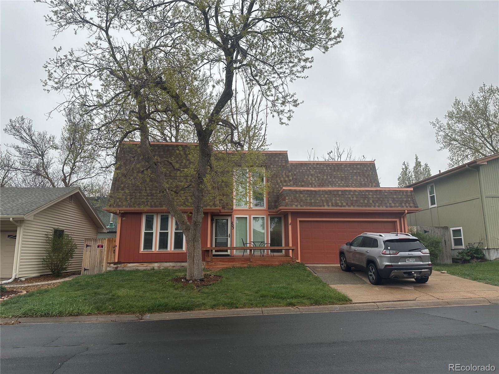 a view of a car parked in front of a house