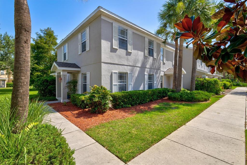 a front view of a house with a yard