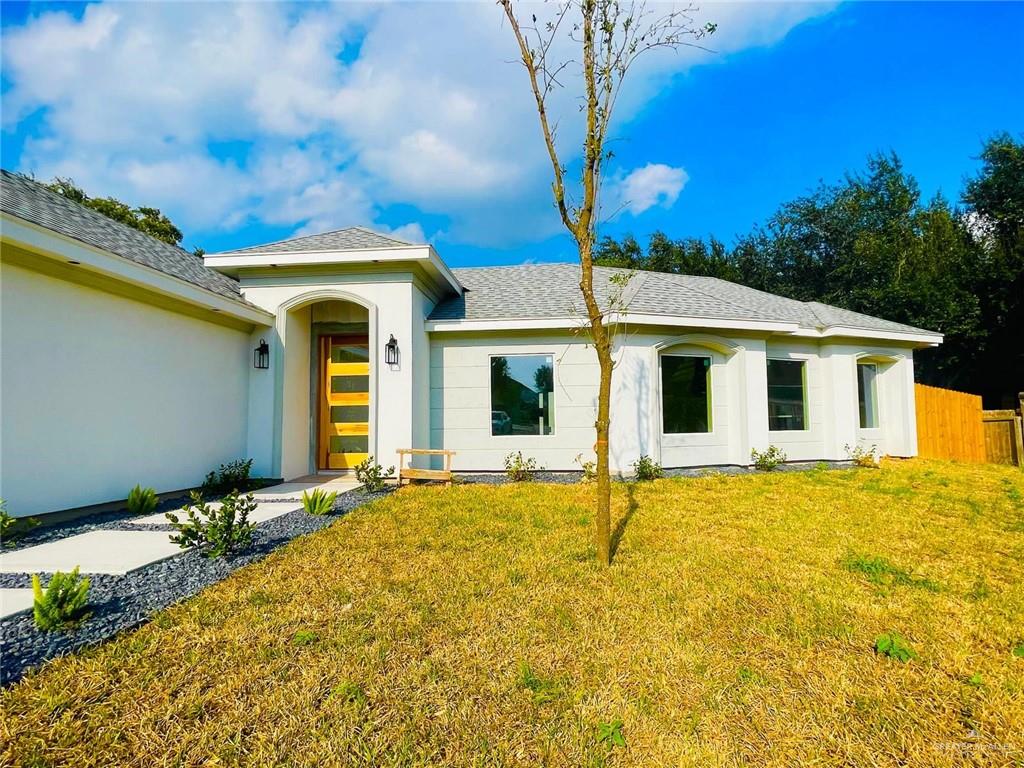 a front view of a house with a yard