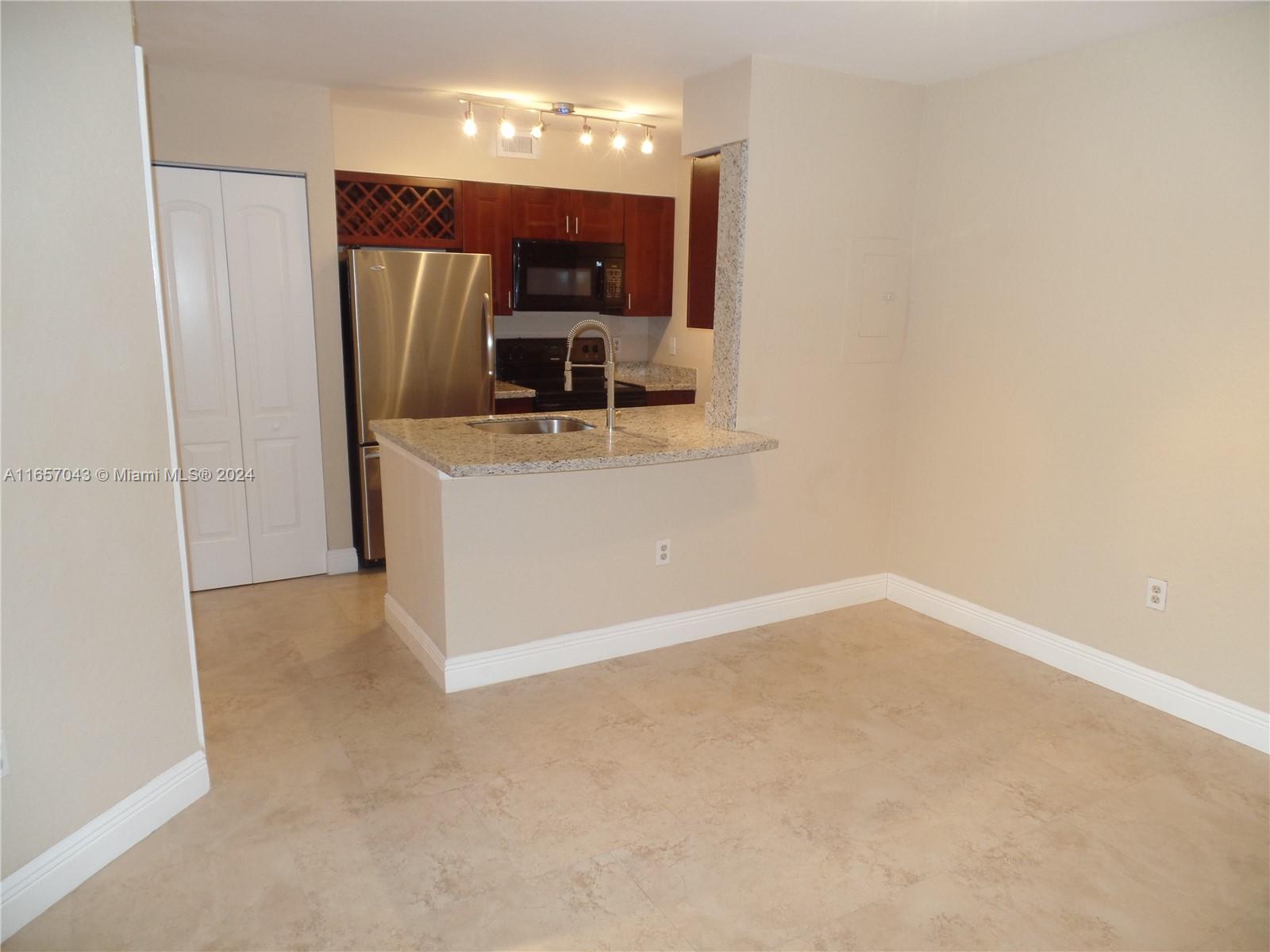 a view of a kitchen with a sink