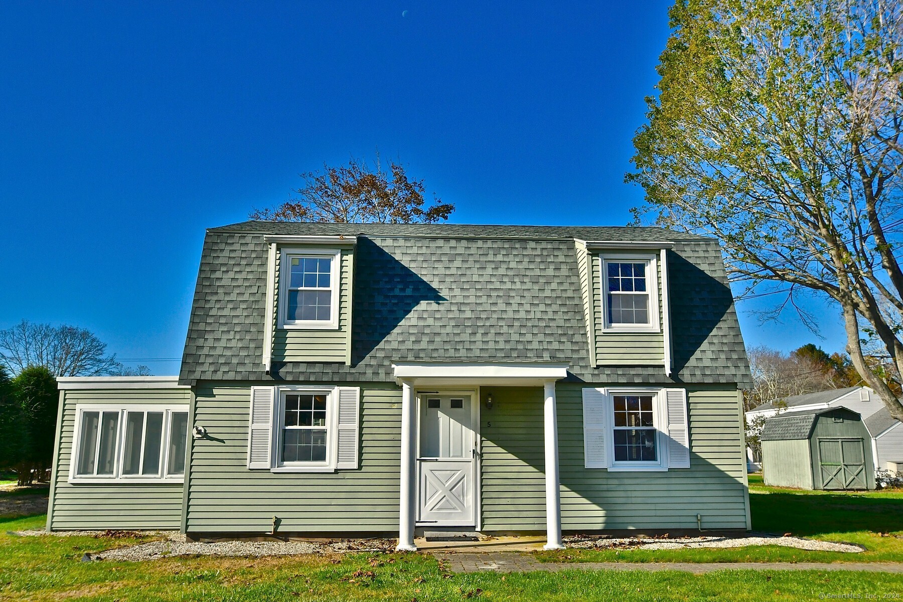 a front view of a house with a yard