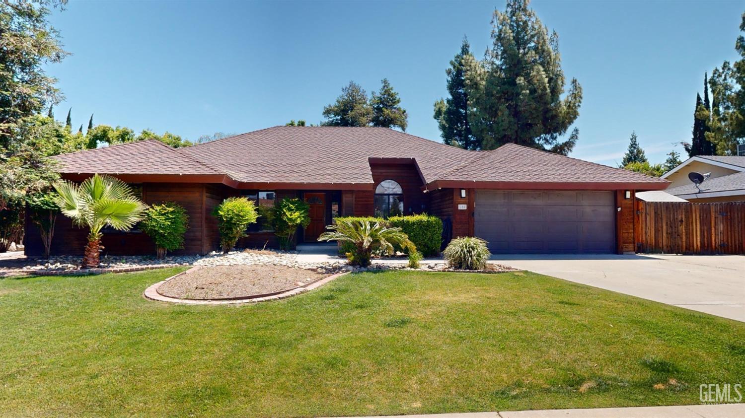 a view of a house with backyard porch and sitting area