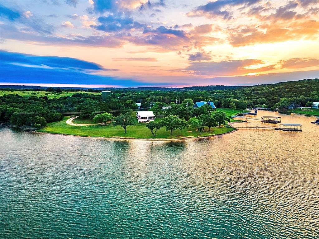 a view of a lake with a yard