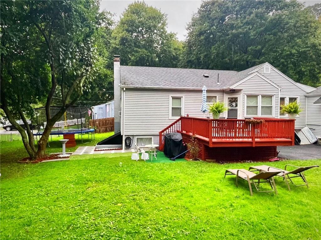 a view of a house with a yard porch and sitting area