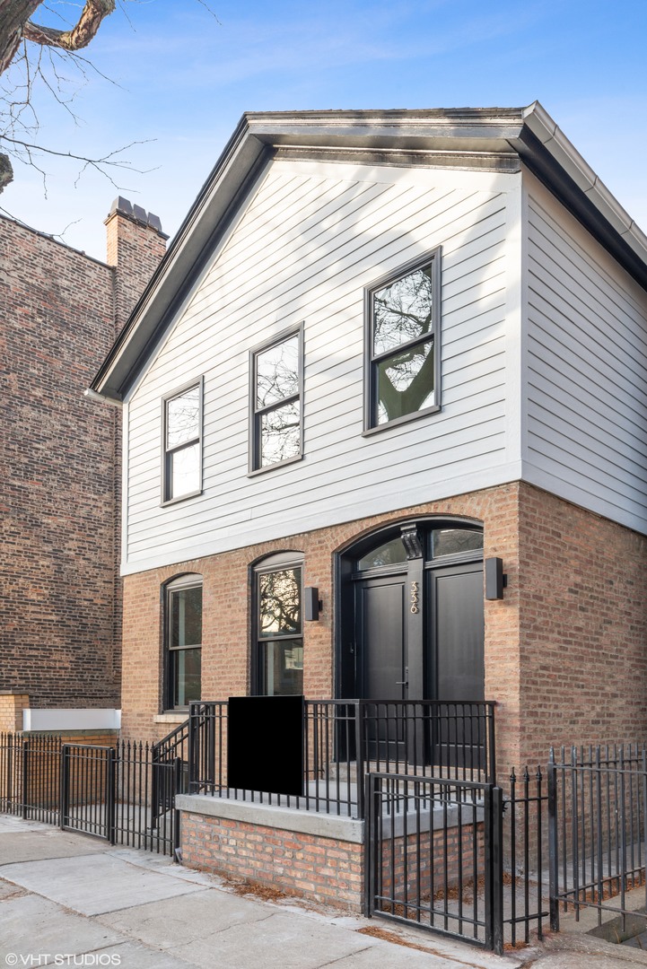 a front view of a house with glass windows