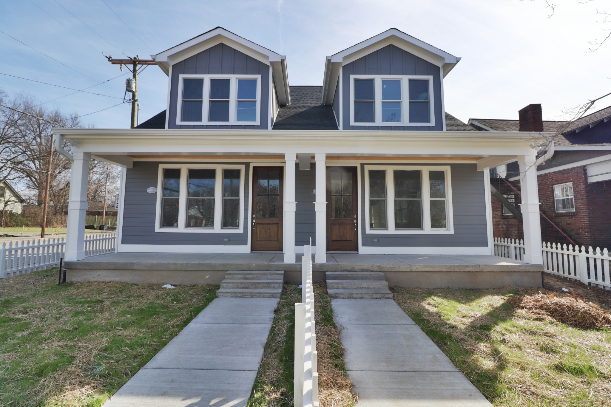 front view of a house with a yard