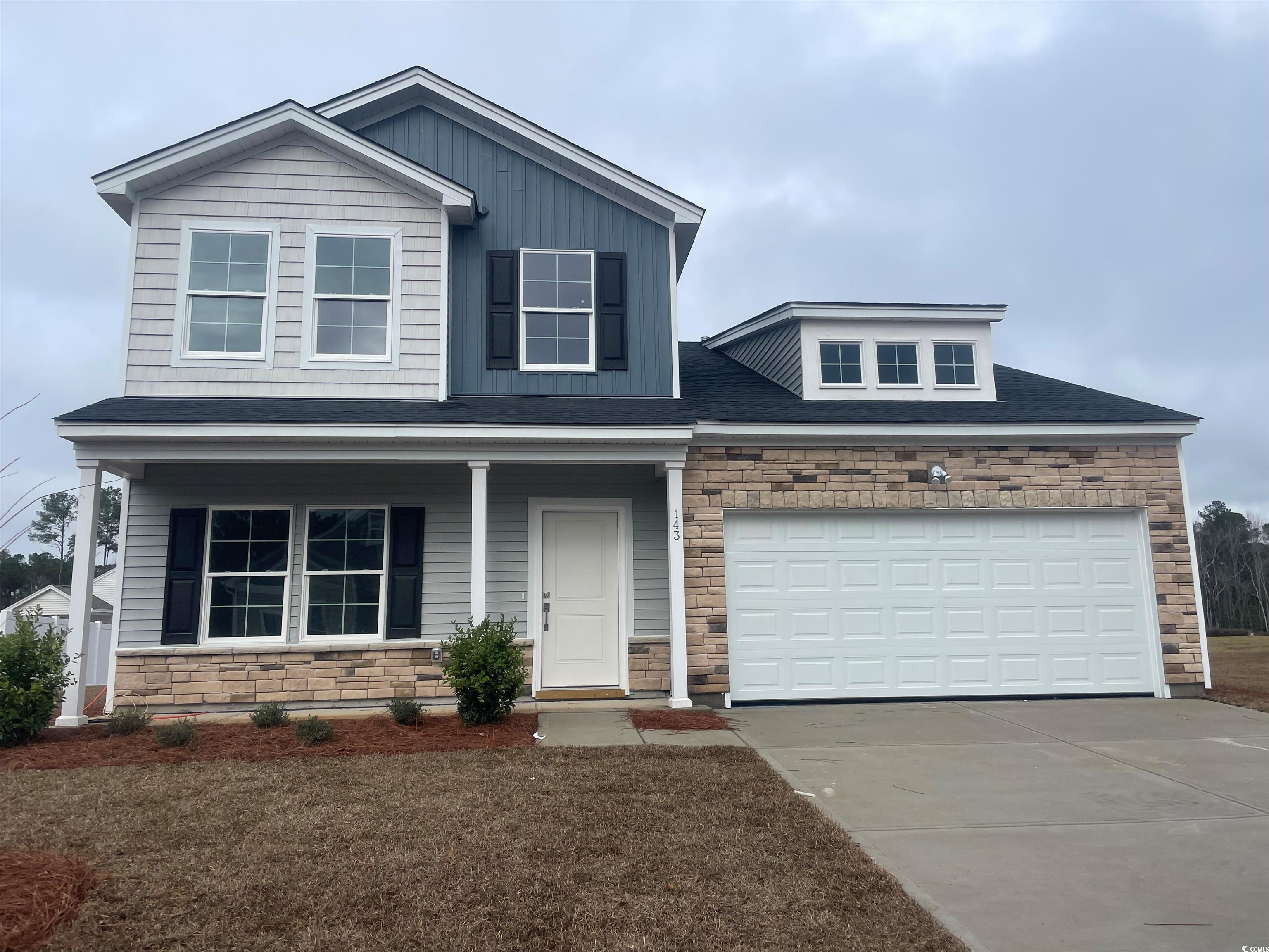 View of front of property featuring a porch and a