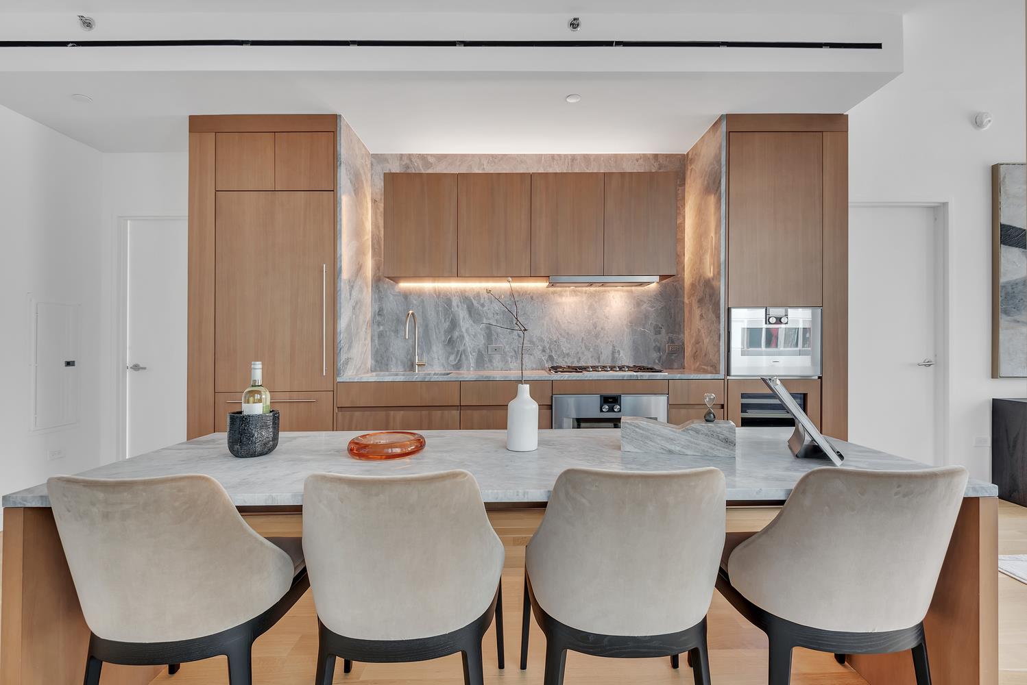 a dining room with furniture a window and wooden floor