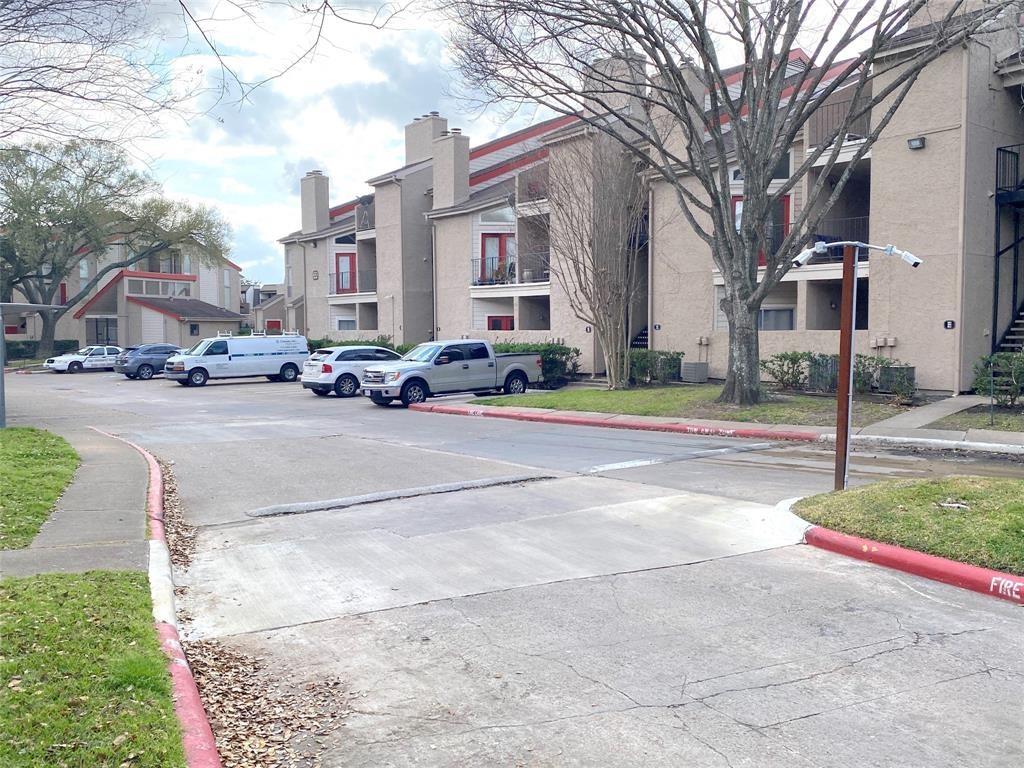 a view of a street with a building in the background