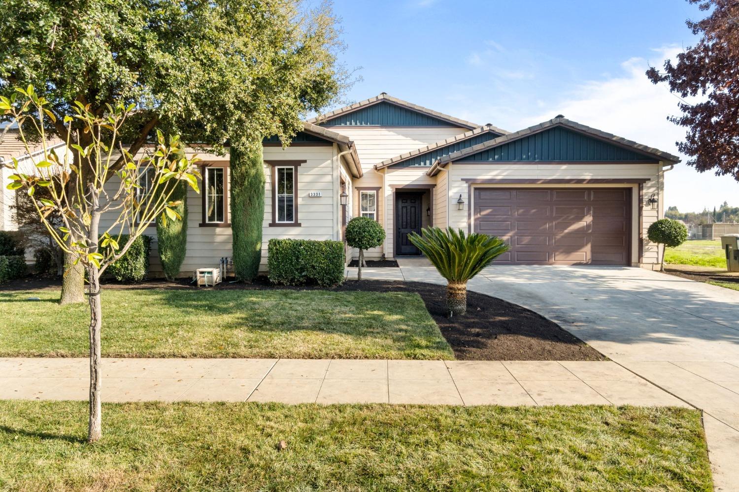 a front view of a house with garden