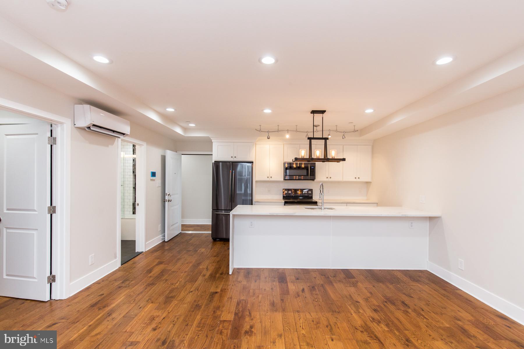 a view of kitchen with wooden floor