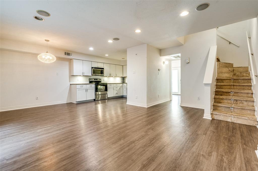 a view of kitchen with stainless steel appliances refrigerator oven and stove