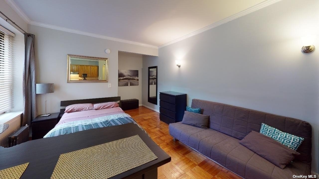 a living room with furniture and a rug