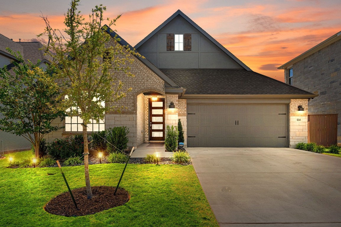 a front view of a house with garden