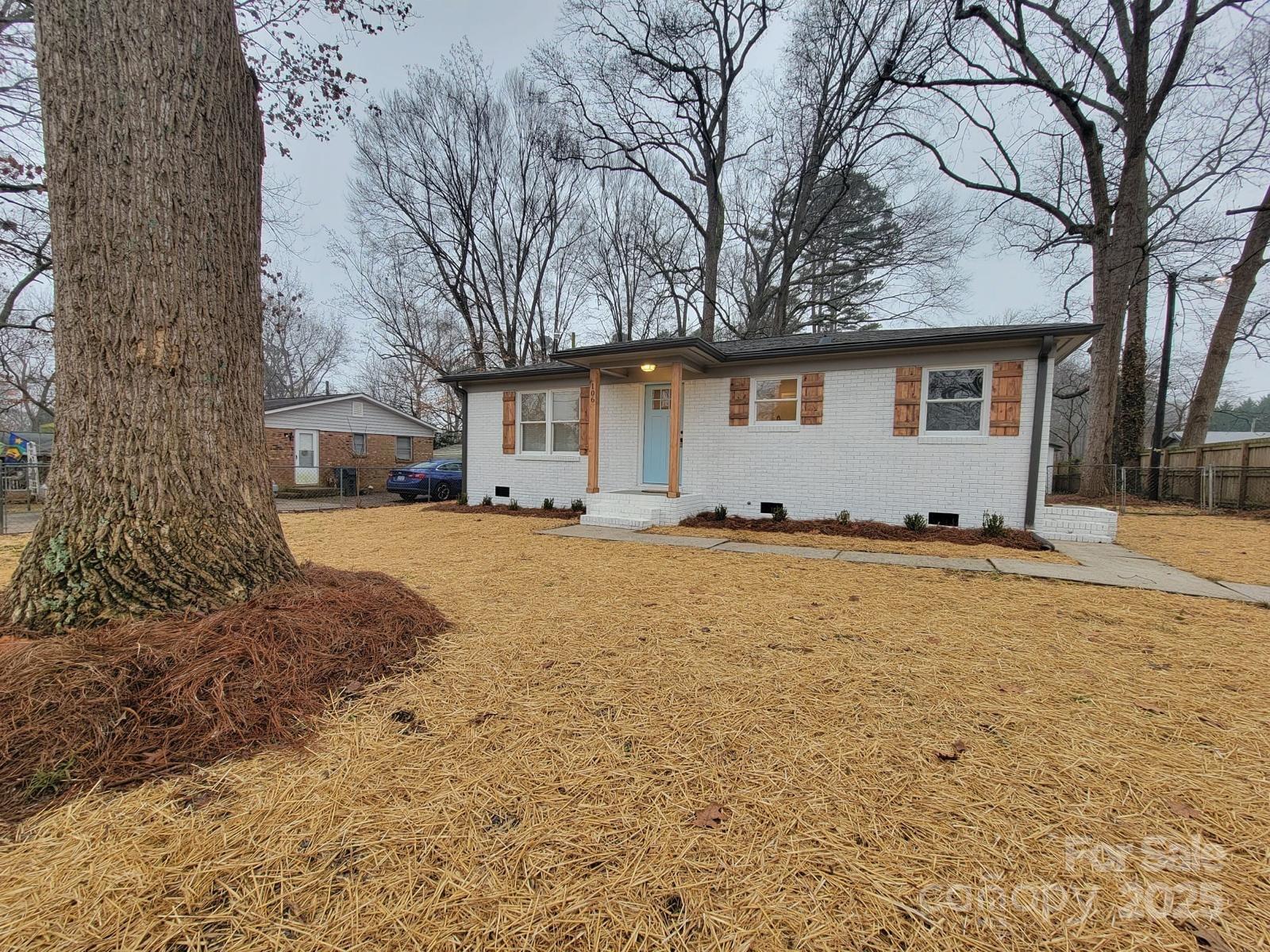 a view of house with yard covered in snow