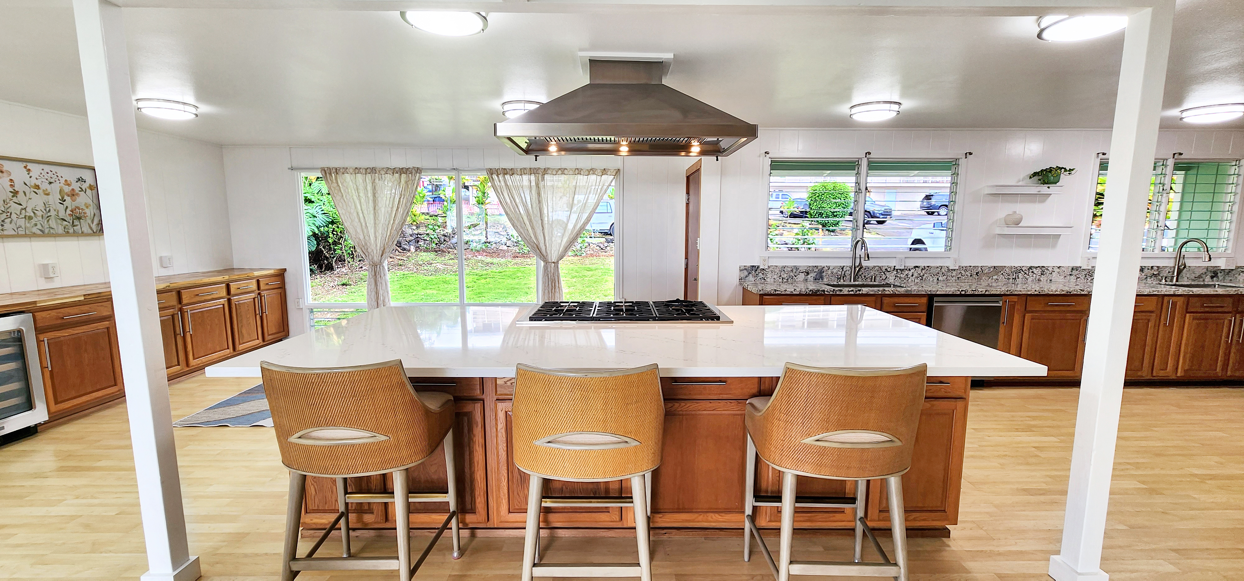 Oversized quartz island anchors dining and living room