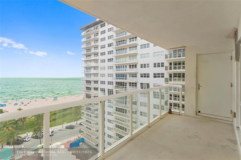 a view of a balcony with an ocean view