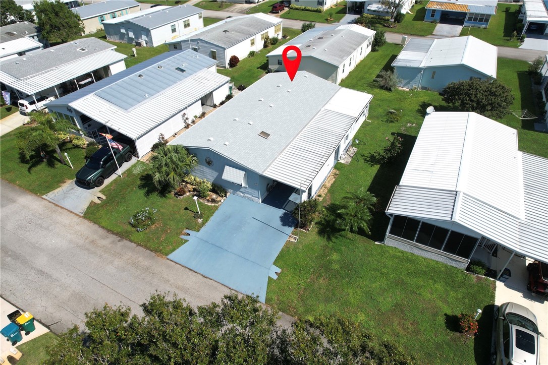 an aerial view of a house with a garden