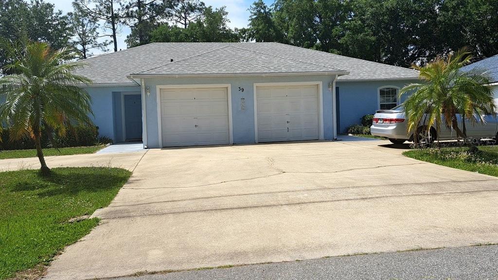 a house with yard in front of it