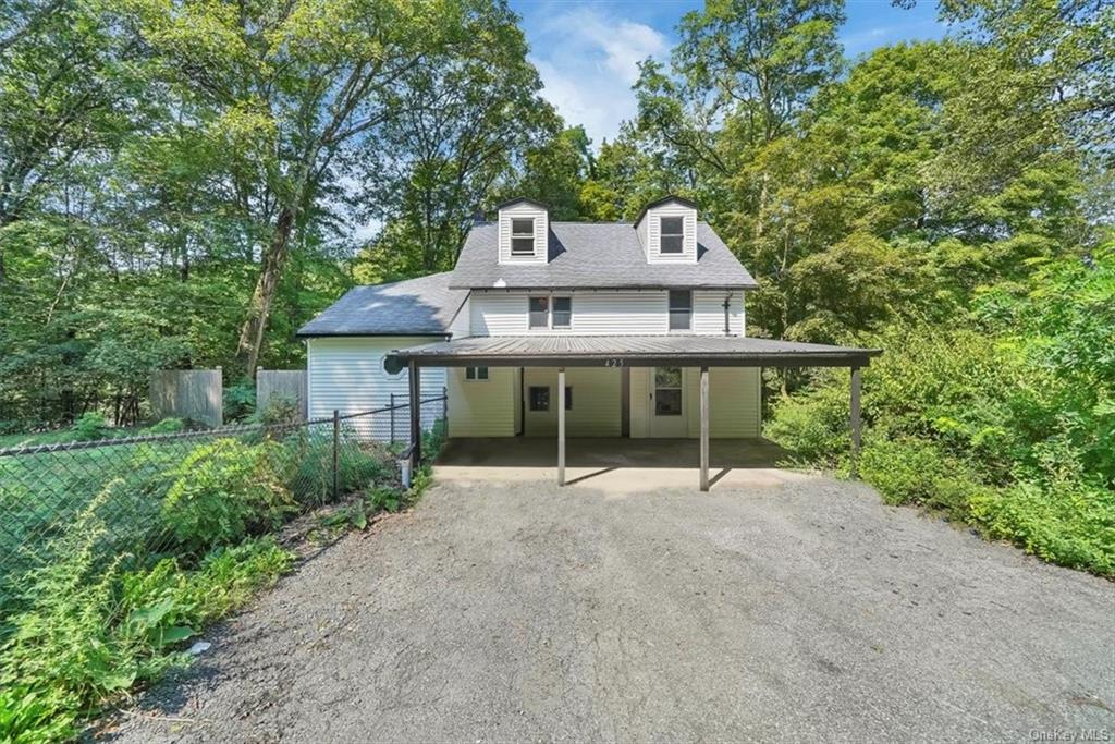 a house with trees in the background