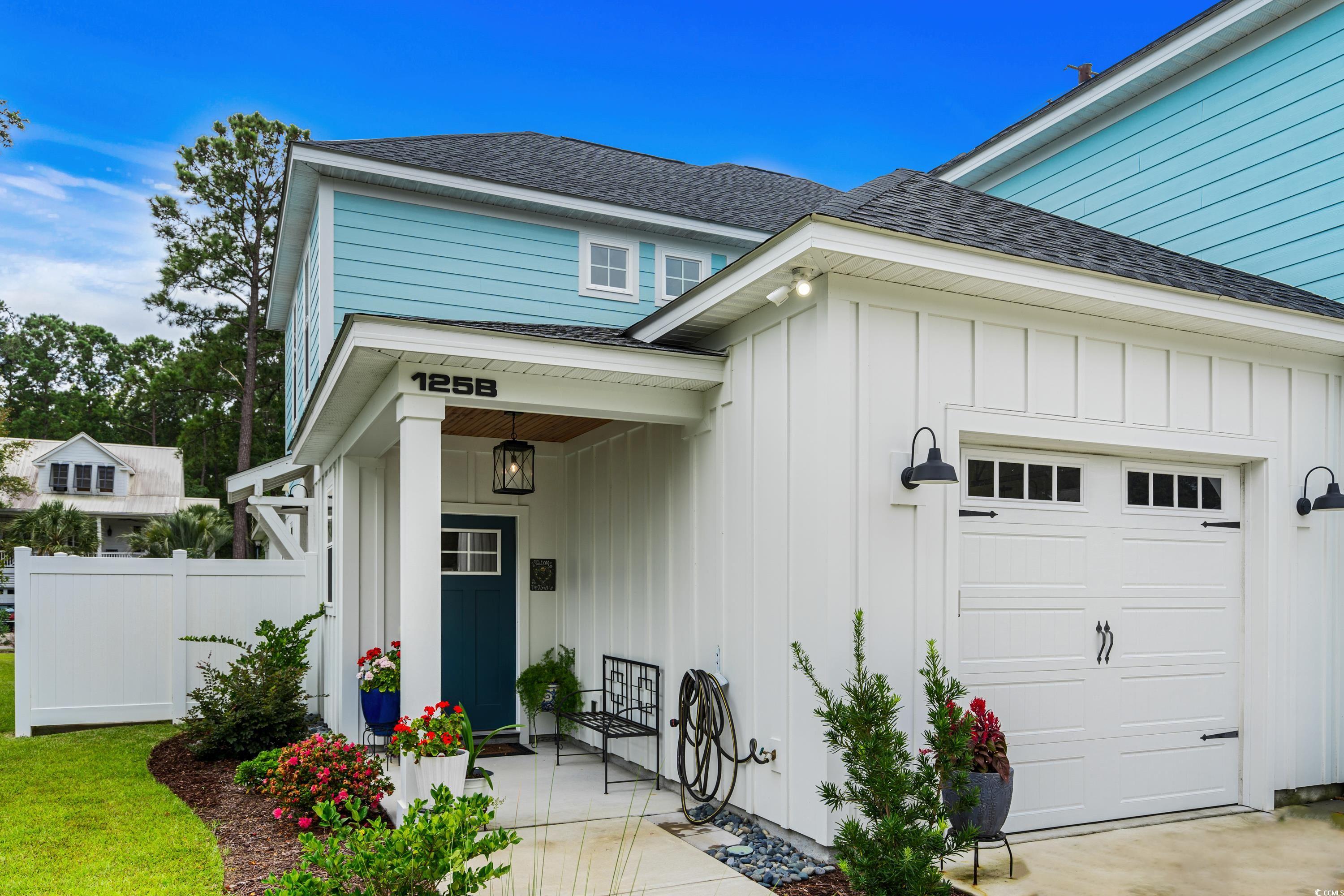 View of exterior entry featuring a garage