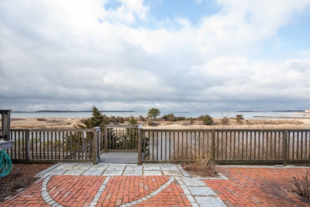 a view of balcony with wooden floor