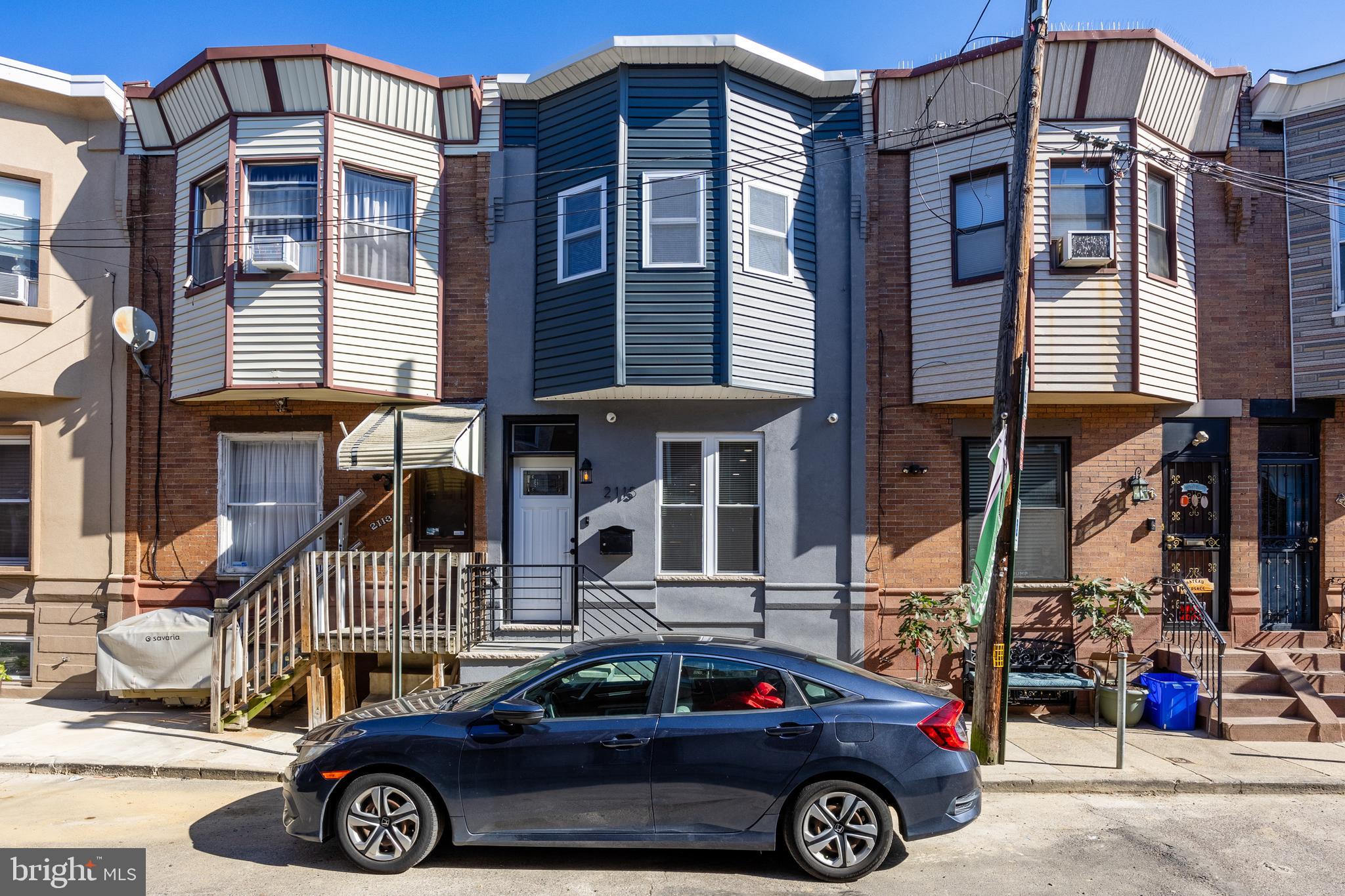 a car parked in front of a house