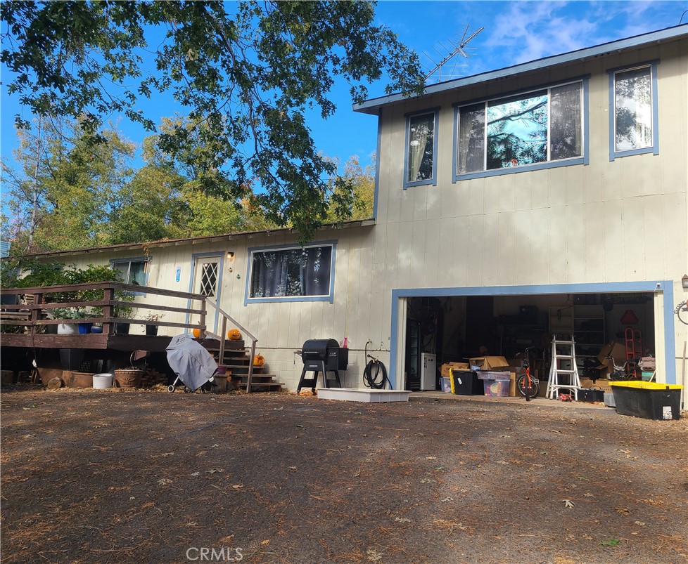 a view of the front house with outdoor seating