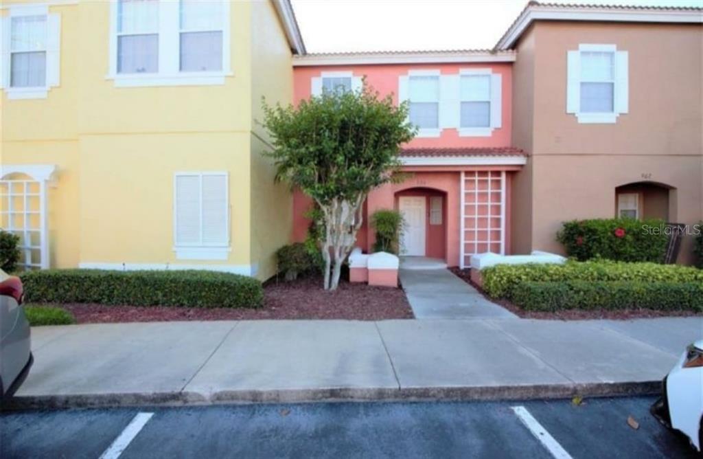 a front view of a house with yard