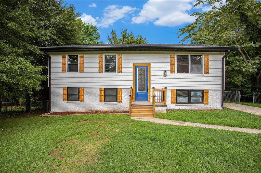 front view of a house with a yard