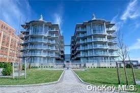 a view of a tall building with a yard