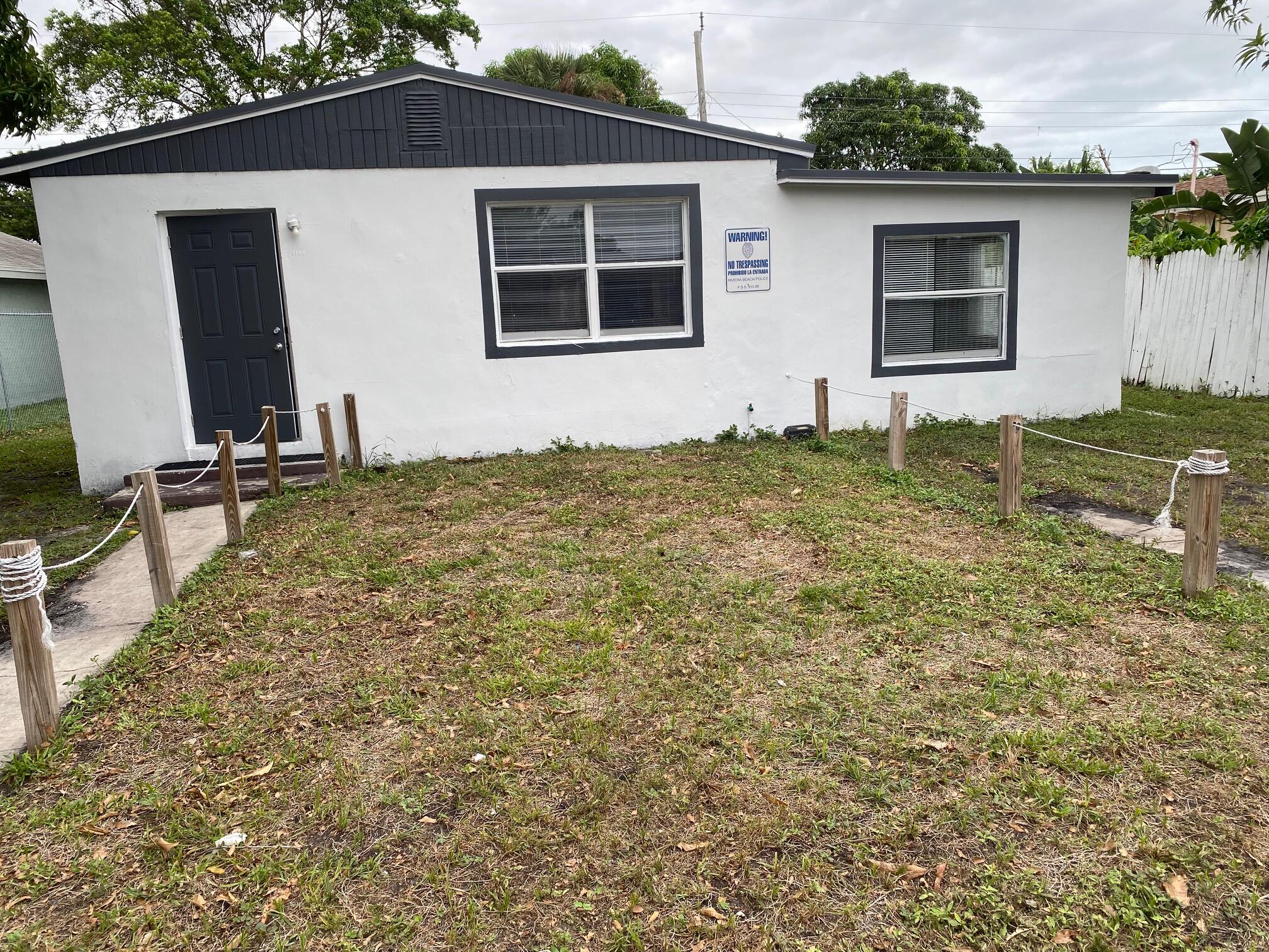 a house with yard in front of it