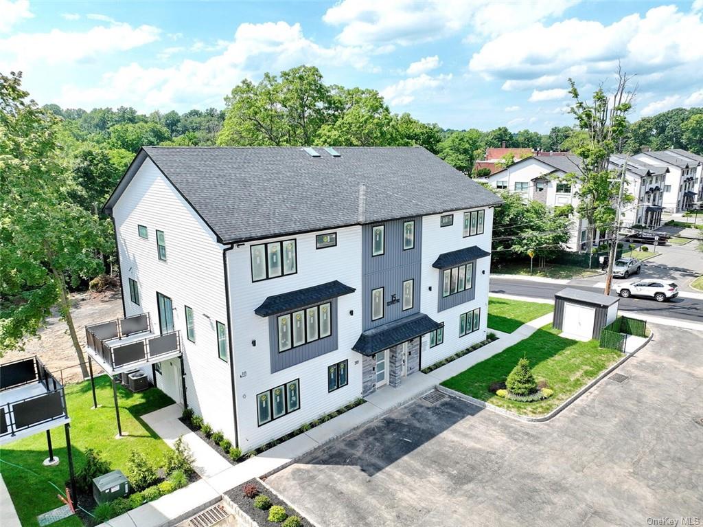 a aerial view of a house with swimming pool and sitting area