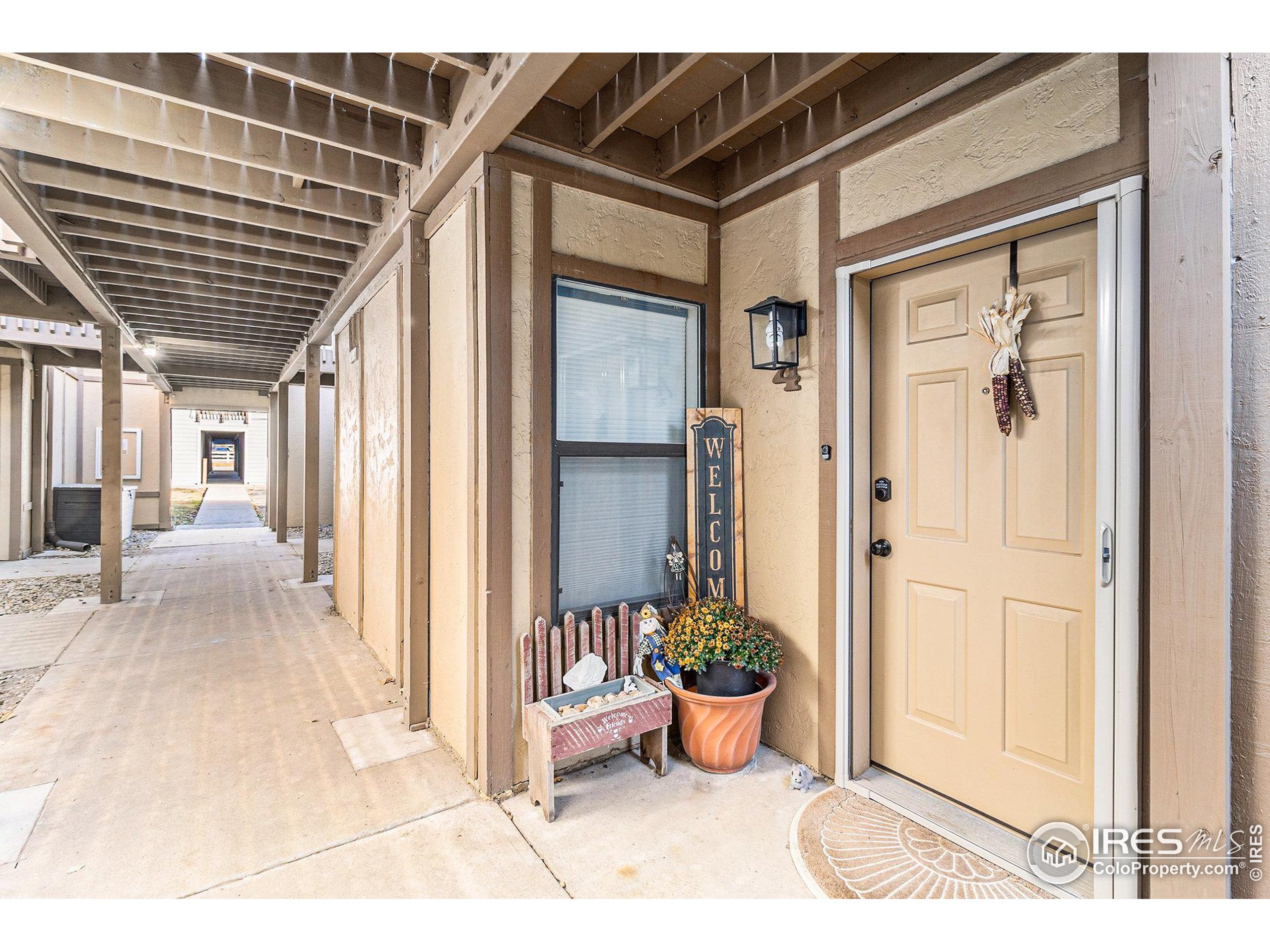 a view of a balcony door and dining room