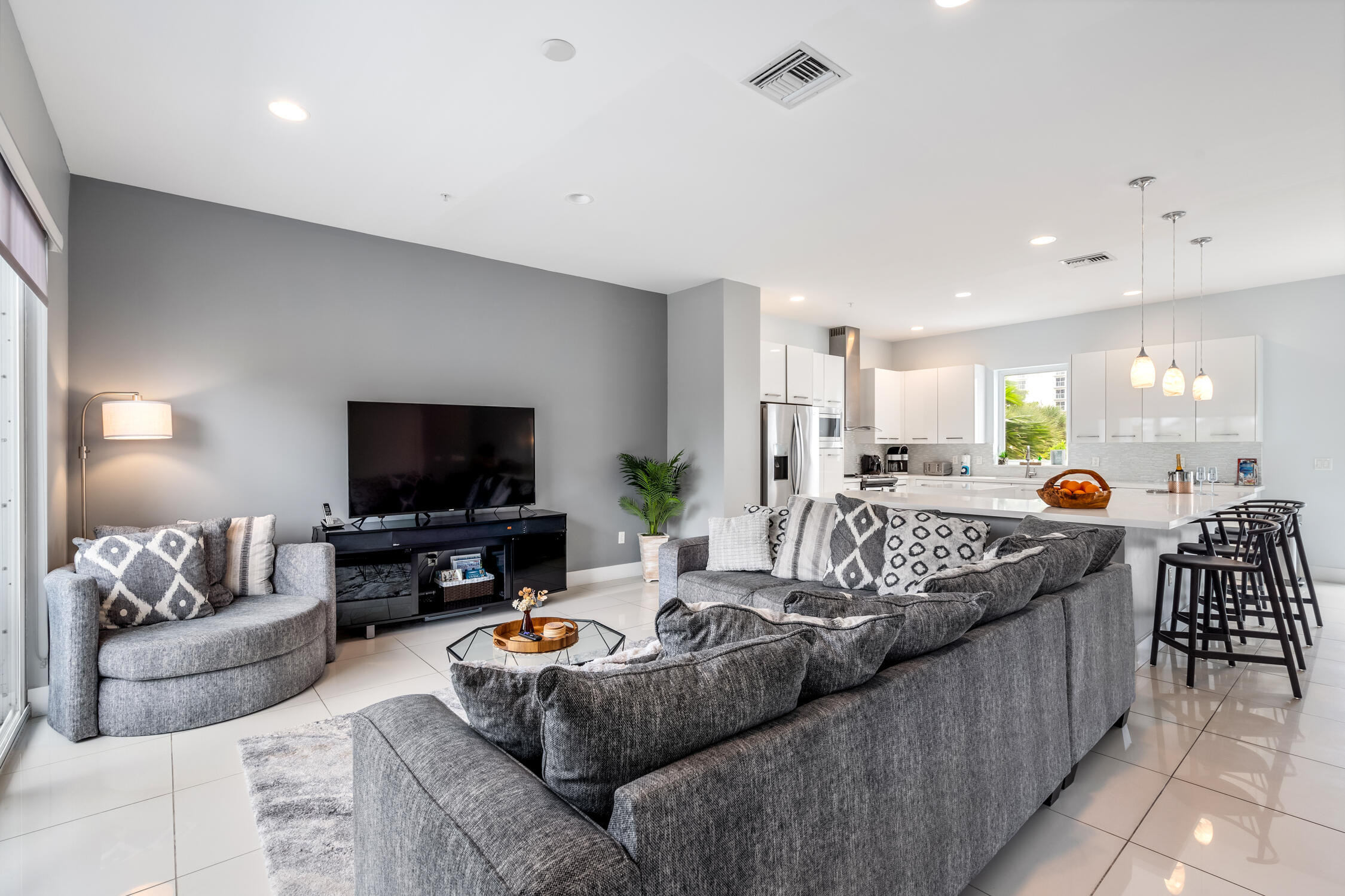 a living room with furniture and a flat screen tv