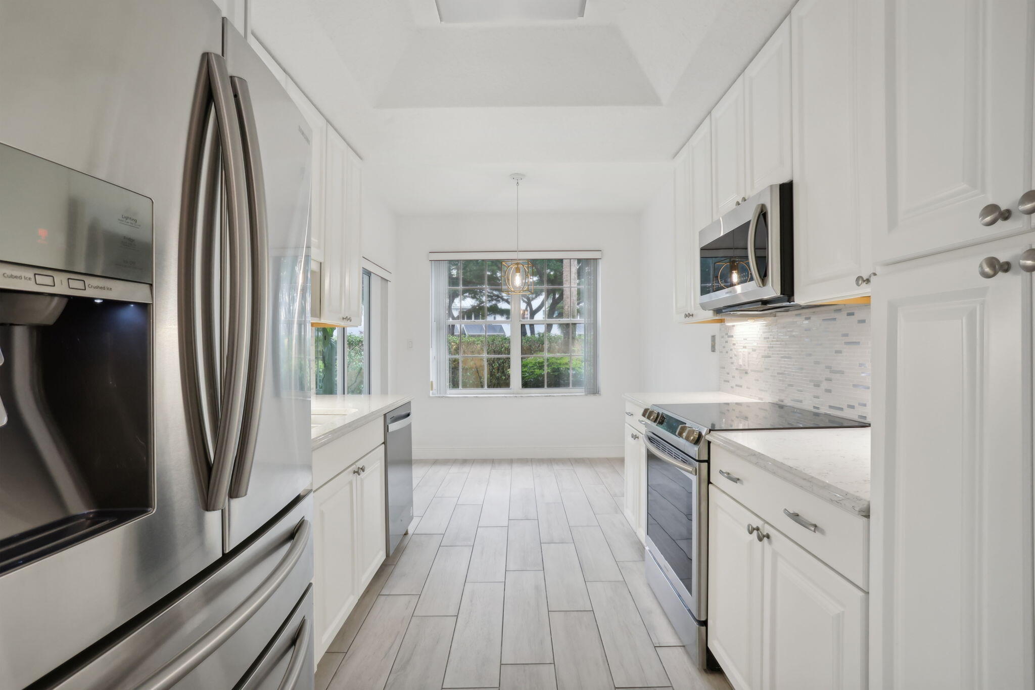 a kitchen with a sink stove and refrigerator