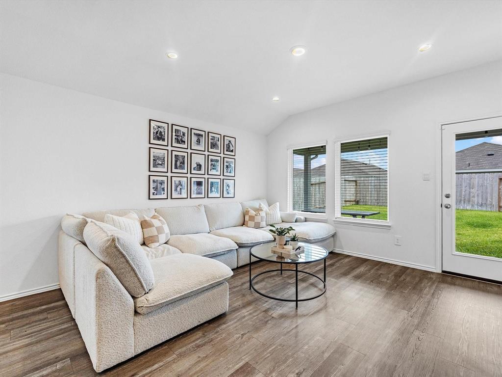 a living room with furniture and a window