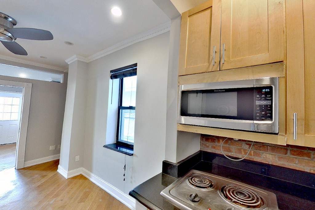 a kitchen with a stove and a microwave